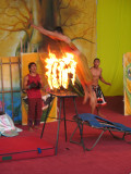 Trampoline jump over flaming rings