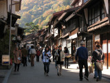 Crowded path with autumn foliage beyond