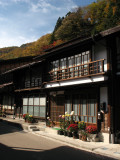 Pair of old houses beneath the hills