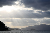 Late afternoon sun peeking through the clouds