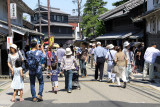 Visitors walking down the historic street