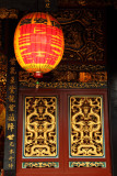 Paper lantern and ornate doors, Baoan Temple
