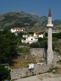 Remnant minaret beside mosque ruins