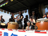 Taiko corps aboard a truck