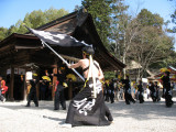 Waving a flag outside the Hon-dō