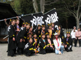 Parade participants posing with a foreigner