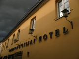 Hotel facade and bleak clouds