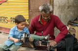 tailor and his assistant on the street in Rishikesh.jpg