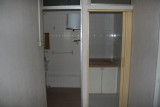 Before: Looking into second bath and prayer room from upstairs landing