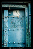 Blue door with welcoming message