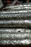 A scroll holder made of silver