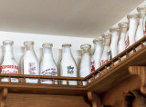 A Line Of Old Milk Bottles