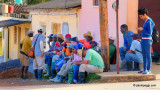 End of the day in a strange late afternoon sunlight: tobaccos workers waiting the camion to back home