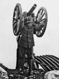 c. 1916 - Italian soldier carrying field gun to higher ground