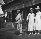 c. 1904 - Laborer and middle class men in front of store