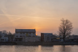 Sun peering out amid downtown buildings