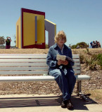 #34: Seated visitor with catalogue