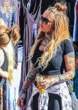 Tattooed woman at the 4th Avenue Street Fair