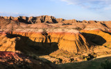 The setting sun paints the Yellow Mounds in Badlands National Park