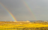 Double rainbow lights up the landscape in Badlands National Park