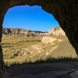 View through the Saddle Rock Trail tunnel in Scotts Bluff National Monument