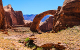 Partial view of Rainbow Bridge with Navajo Mountain in the background in Rainbow Bridge National Monument