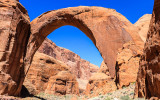 View of Rainbow Bridge framed by the deep blue sky in Rainbow Bridge National Monument