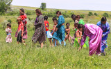 Indian Nation women and children gathering wild grains at the Real Bird Reenactment Event