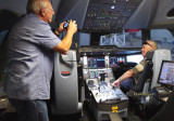 August 2016 - Eric D. Olson taking a photo of Don Boyd in the Airbus A350-900XWB flight simulator
