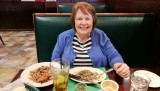 February 2017 - Karen dining on a late lunch of great churrasco, plantains and rice at Molina's Ranch Restaurant in Hialeah