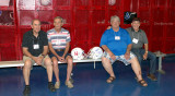 Joe Elizarde, Nick Royer, Mike Turner and John Lund in the old locker room during the HHS-65 50-Year Reunion school tour