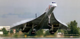 1990 - British Airways Concorde G-BOAA with condensation on top of the delta wing landing on runway 30 at MIA