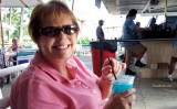 August 2010 - Karen having a rare alcoholic beverage at one of the outdoor bars at the Hale Koa Hotel, a military resort