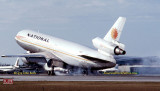 1979 - DC10-30 N83NA smoky touchdown upon landing way down runway 27R at Miami International Airport