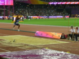 Christian Talor in mid air during his gold medal winning triple jump