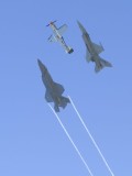The F-35A on the left, the P-51 Mustang in the middle, and the F16 Viper on the right