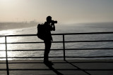 A backlit photographer
