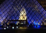 The sculpture within the Pyramid designed by I. M. Pei, is called Throne and was done by the artist Hohei Nawa