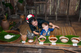 Dusun woman welcomes a young Australian visitor