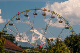 The Jungfrau framed by a Ferris wheel at Thun