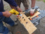 Drilling for brains; the guide keeps the drill straight and hands safe.