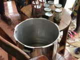 Jars of canned fish coming out of the canner