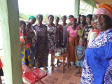 Daughters of Nimba with the canned jars of fish