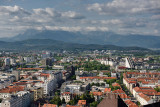 Overview of Ljubljana capital city of Slovenia with Mount Saint Mary and distant Kamnik Savinja Alps mountains from the hilltop 