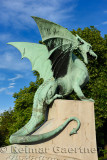 Back side of green sheet copper Dragon statue with tail on Dragon Bridge over Ljubljanica river symbol of Ljubljana capital city