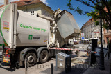 Garbage truck emptying giant underground trash bins in old town section of Ljubljana Slovenia 