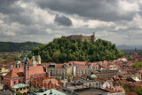 Historic hilltop Ljubljana Castle overlooking the old town of Ljubljana capital city of Slovenia with Triple Bridge and Town Hal