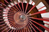 View up the steel double helix spiral staircase at the historic Ljubljana Castle tower on Castle Hill with red bar posts Ljublja