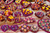 Hand crafted dried pink purple and yellow flowers on a table at an open air stall at the Ljubljana Central Market Vodnik Square 
