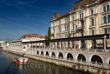 Tour boat on the Ljubljanica river canal at Kresija Building with open air shops at Pogacar Square Central Market Ljubljana Slov